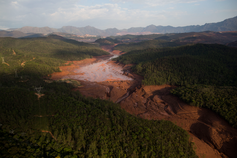 Aerial view of the small town of Bento Rodrigues after a dam burst on Thursday in Minas Gerais state, Brazil, Friday, Nov. 6, 2015. Brazilian rescuers searched feverishly Friday for possible survivors after two dams burst at an iron ore mine in a southeastern mountainous area. (AP Photo/Felipe Dana)